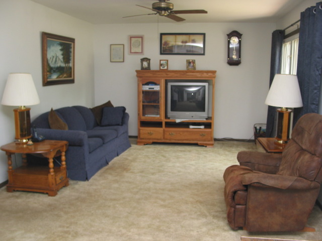64 Eastfield Road Montgomery, IL 60538 - Photo 7 of 22 a living room with furniture and a flat screen tv