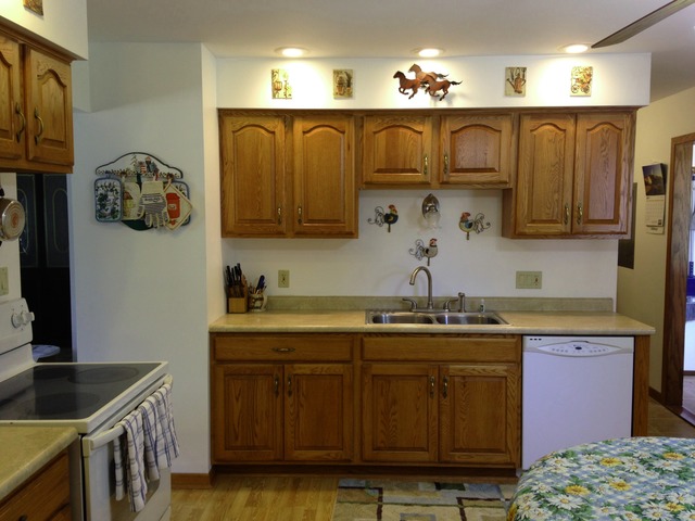 64 Eastfield Road Montgomery, IL 60538 - Photo 9 of 22 a kitchen with stainless steel appliances granite countertop a sink a stove and cabinets