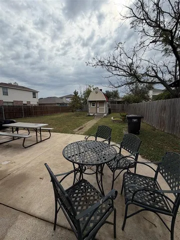 a view of a terrace with furniture and stove