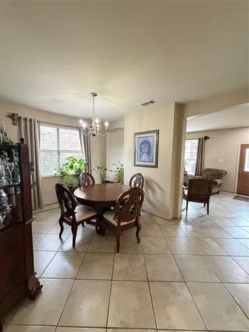 a view of a dining room with furniture and a livingroom