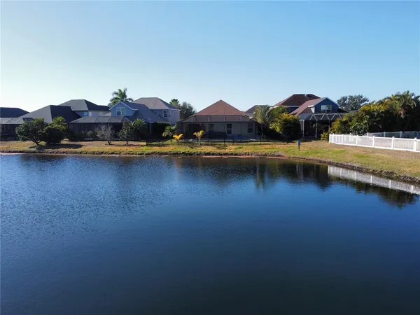 a aerial view of a house with a yard