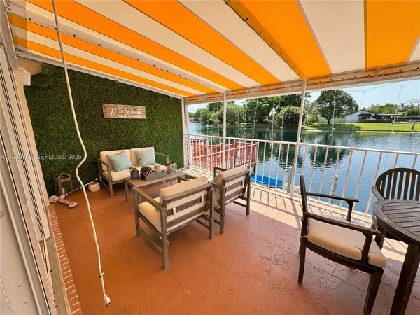 a view of a lake with a table and a chair