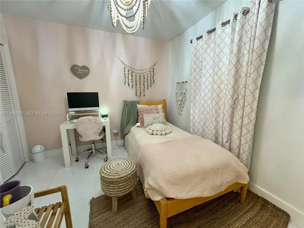 a bedroom with a bed and furniture