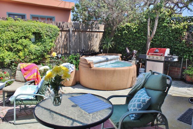a table and chairs in a patio