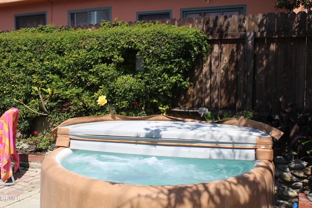 a bedroom with a bed and a table in it