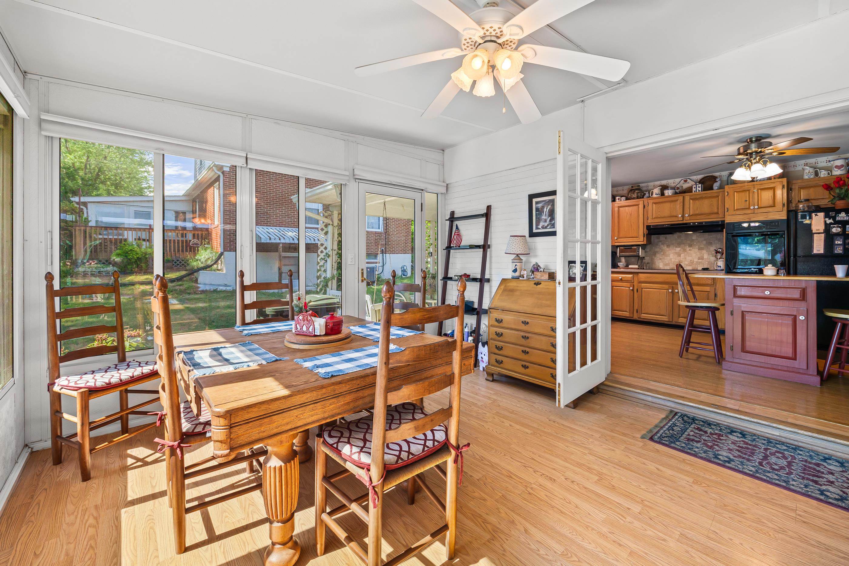 208 Tuxedo Road Staunton, VA 24401 - Photo 21 of 46 a dining room with furniture water view and large windows
