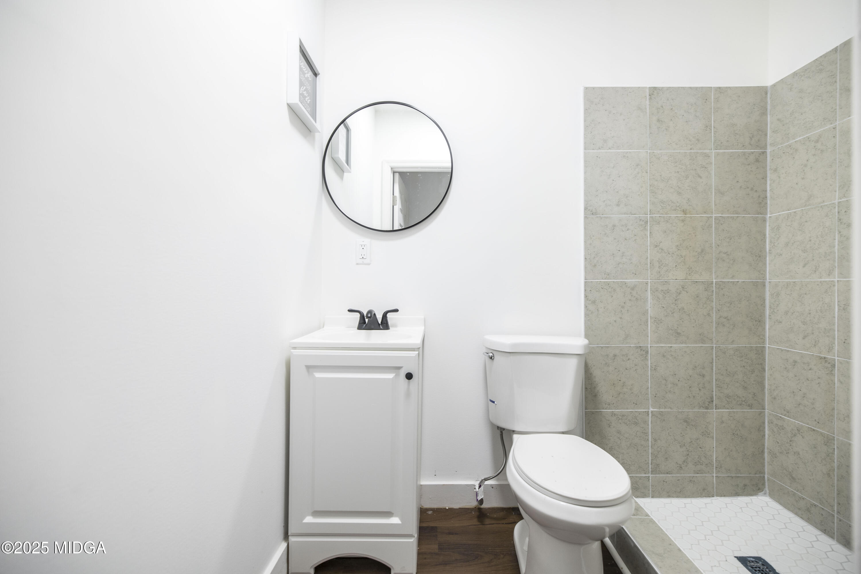 335 Lincoln Avenue Macon, GA 31201 - Photo 16 of 20 a white toilet sitting next to a bathroom sink