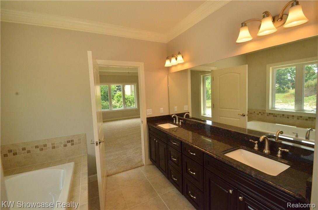 4131 Inverrary Court Commerce Township, MI 48382 - Photo 13 of 34 Master Bath double sinks, sunken tub, granite countertops