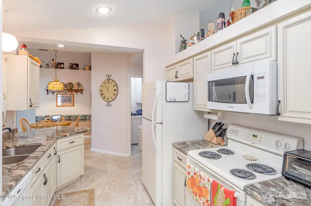 a kitchen with a stove and a sink