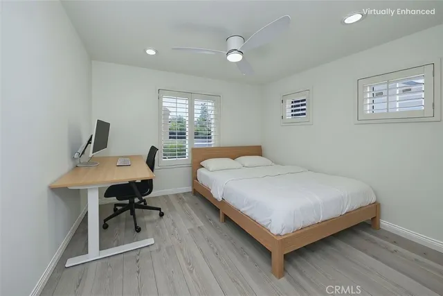 a bedroom with a bed and a table in it