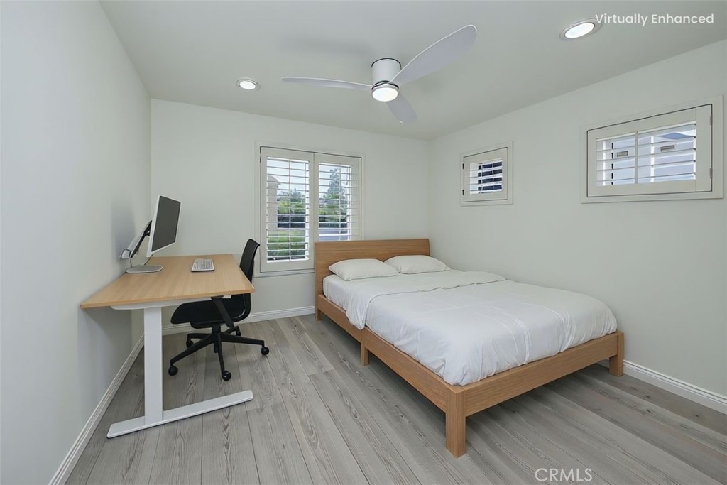 5010 Golondrina Way, Unit 64 Oceanside, CA 92057 - Photo 16 of 31 a bedroom with a bed and a table in it