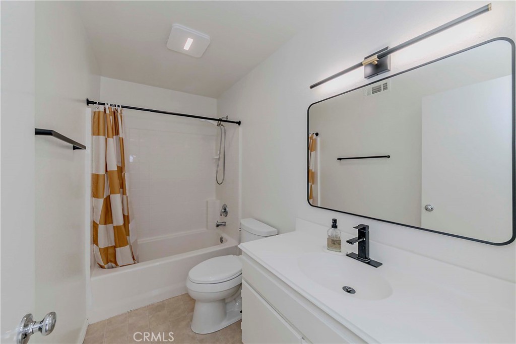 5010 Golondrina Way, Unit 64 Oceanside, CA 92057 - Photo 18 of 31 a bathroom with a sink toilet and shower