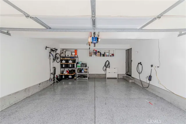 a view of a room with lots of white furniture