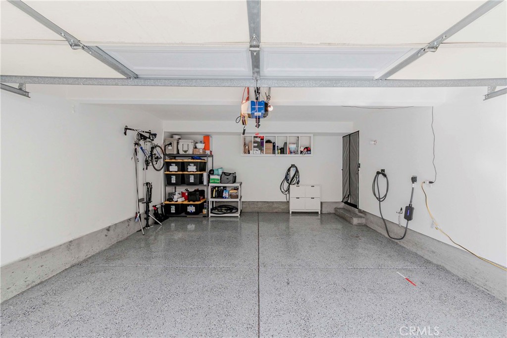 5010 Golondrina Way, Unit 64 Oceanside, CA 92057 - Photo 19 of 31 a view of a room with lots of white furniture
