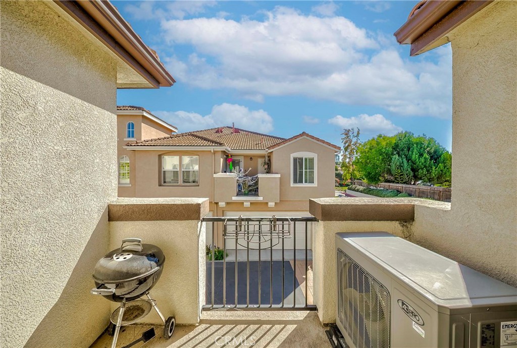 5010 Golondrina Way, Unit 64 Oceanside, CA 92057 - Photo 20 of 31 a view of a house with a roof deck