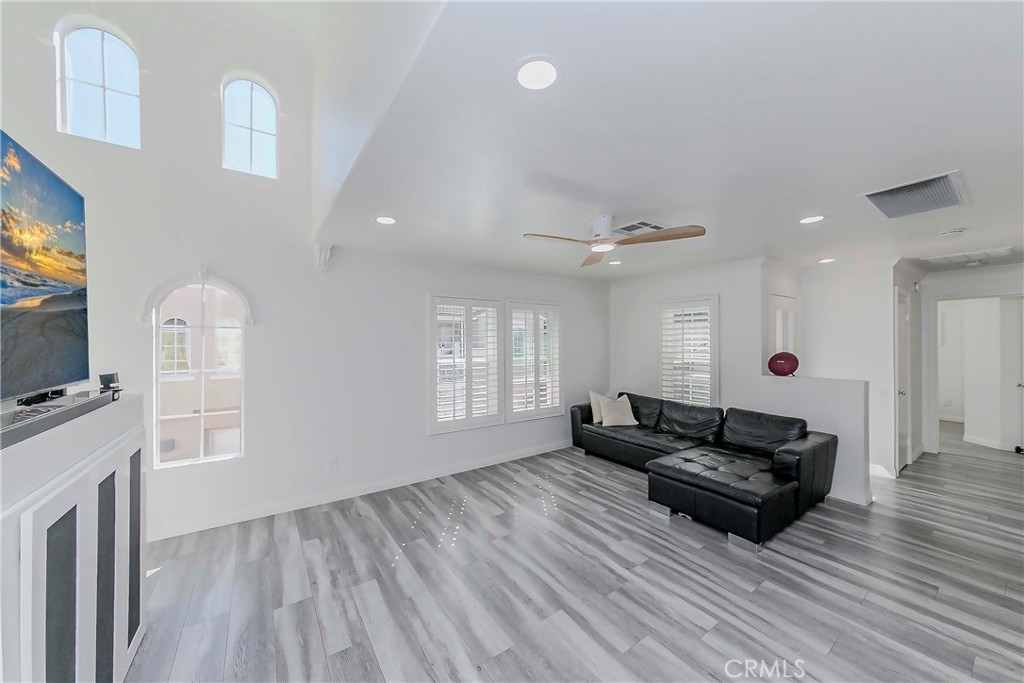 5010 Golondrina Way, Unit 64 Oceanside, CA 92057 - Photo 2 of 31 a living room with furniture and a flat screen tv