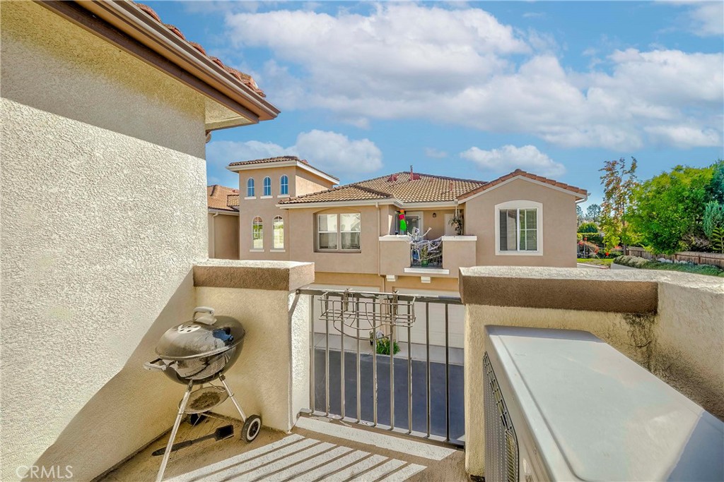 5010 Golondrina Way, Unit 64 Oceanside, CA 92057 - Photo 21 of 31 a balcony with table and chairs