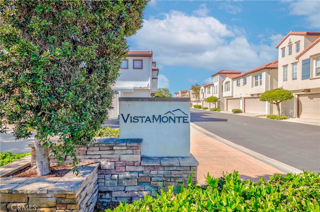 5010 Golondrina Way, Unit 64 Oceanside, CA 92057 - Photo 24 of 31 a sign board with buildings in the background