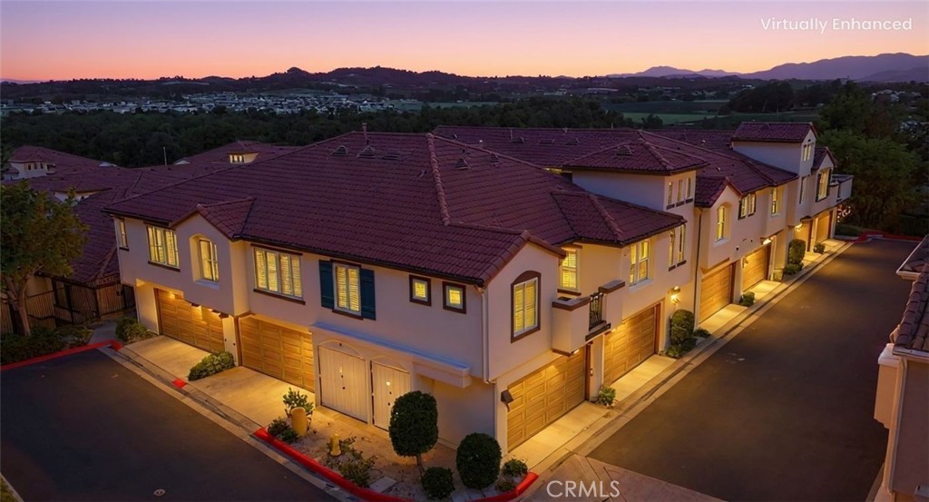 5010 Golondrina Way, Unit 64 Oceanside, CA 92057 - Photo 30 of 31 a view of a big house with a mountain