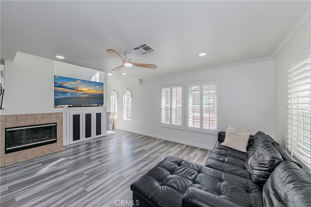 5010 Golondrina Way, Unit 64 Oceanside, CA 92057 - Photo 3 of 31 a living room with furniture flat screen tv and a fireplace