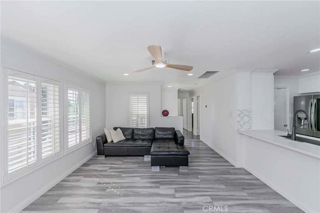 5010 Golondrina Way, Unit 64 Oceanside, CA 92057 - Photo 4 of 31 a living room with furniture and a large window