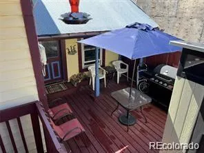 a dinning room with furniture and wooden floor