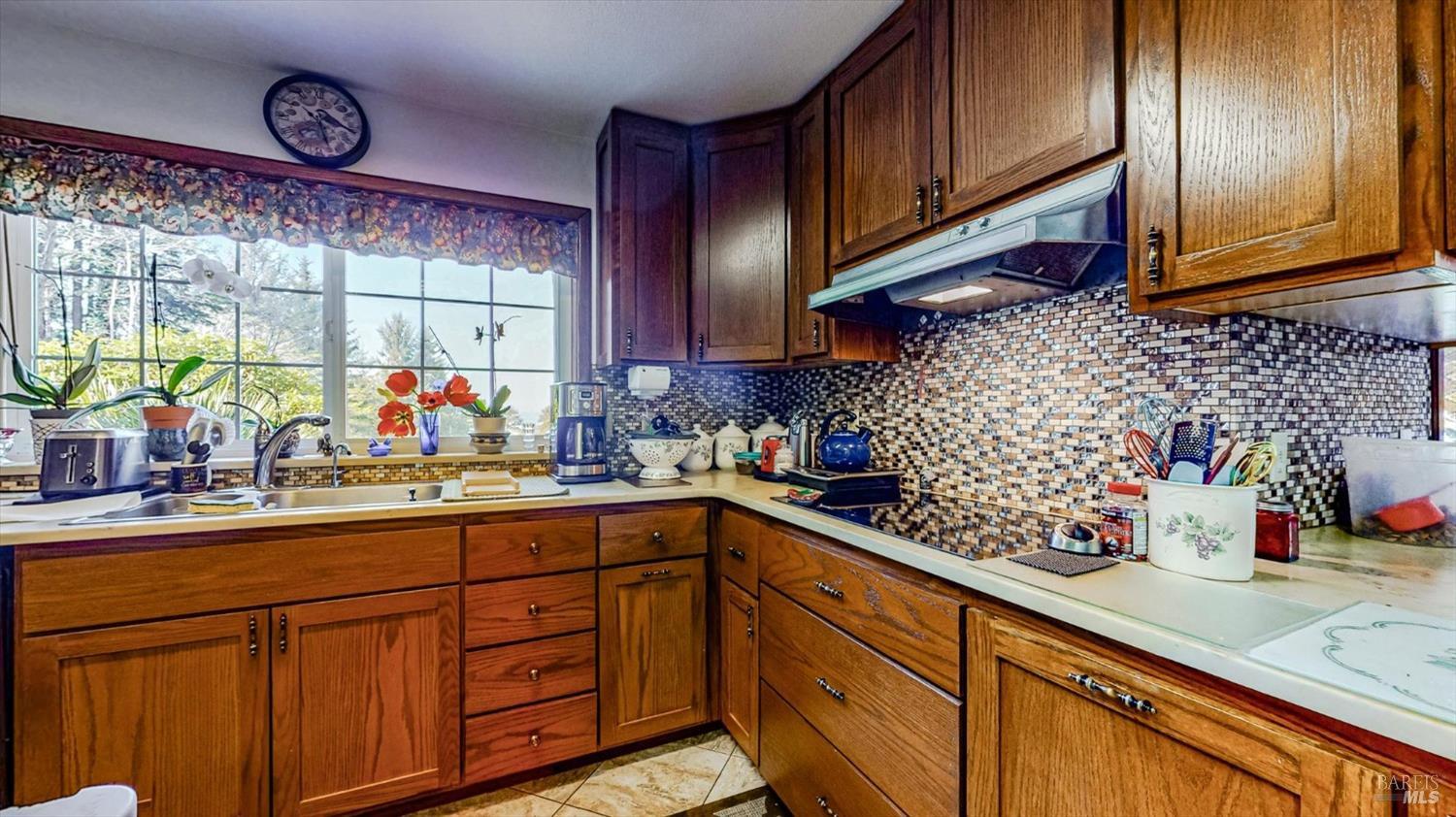 3535 Patricks Point Drive Trinidad, CA 95570 - Photo 23 of 61 a kitchen with stainless steel appliances wooden cabinets and a sink
