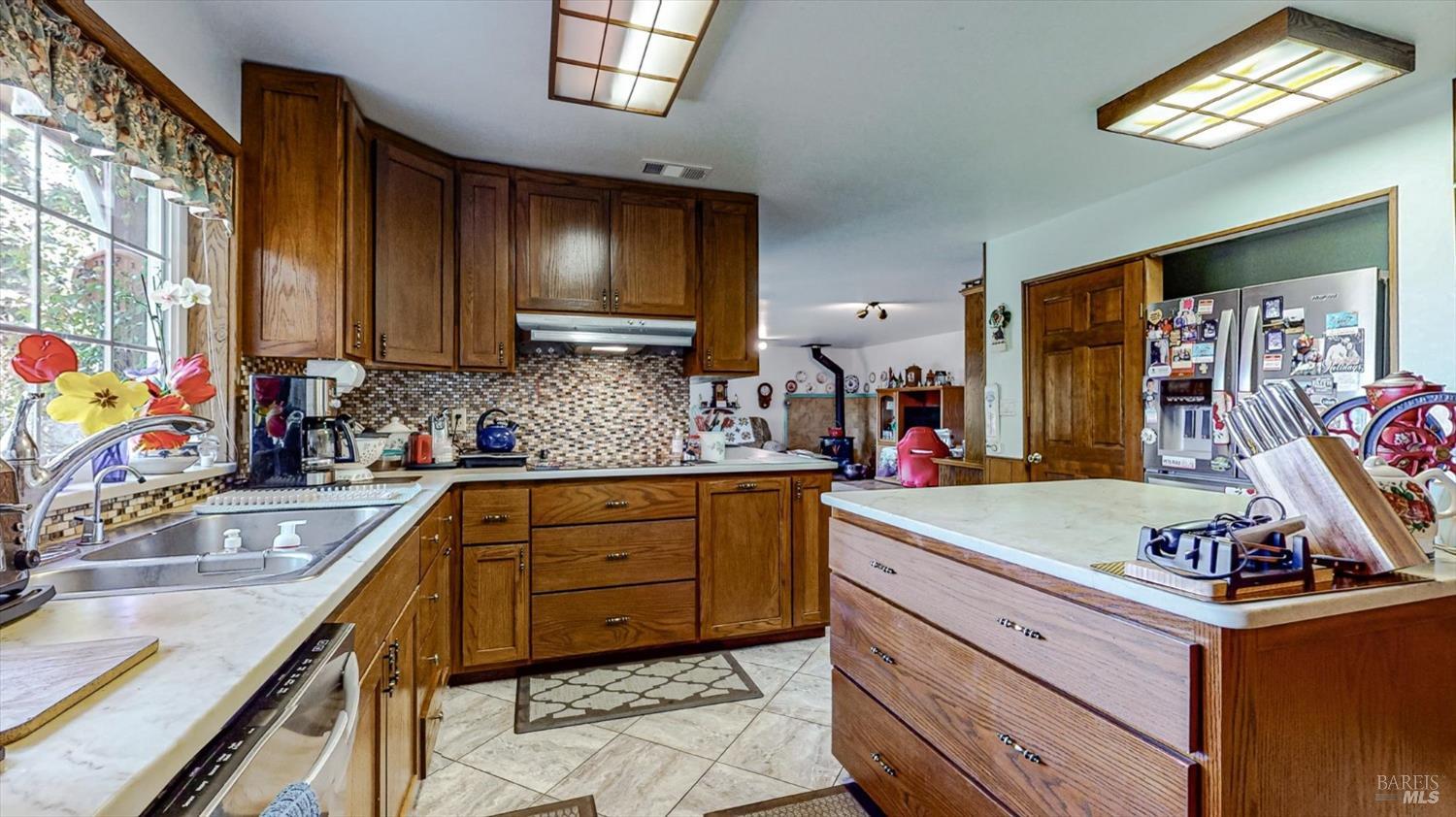 3535 Patricks Point Drive Trinidad, CA 95570 - Photo 26 of 61 a kitchen with granite countertop a sink stove and cabinets