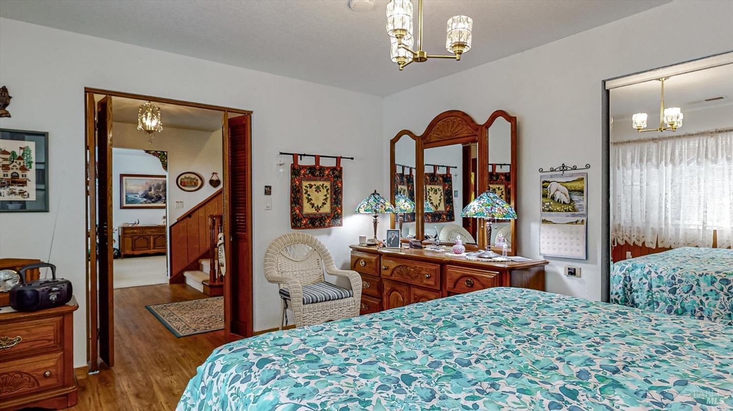 3535 Patricks Point Drive Trinidad, CA 95570 - Photo 37 of 61 a bedroom with a bed and a large mirror on the dresser