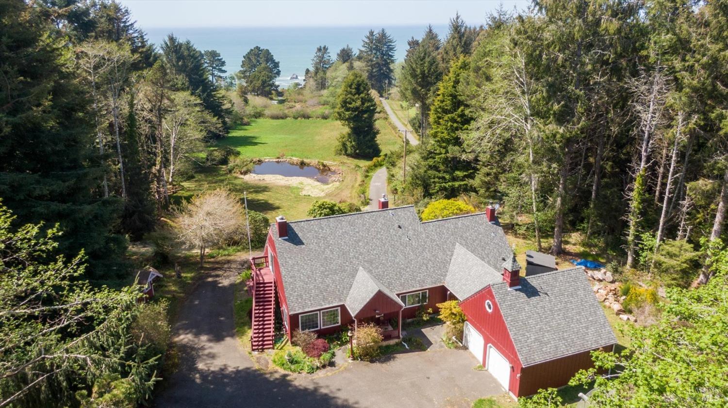 3535 Patricks Point Drive Trinidad, CA 95570 - Photo 58 of 61 an aerial view of a house with swimming pool and large trees