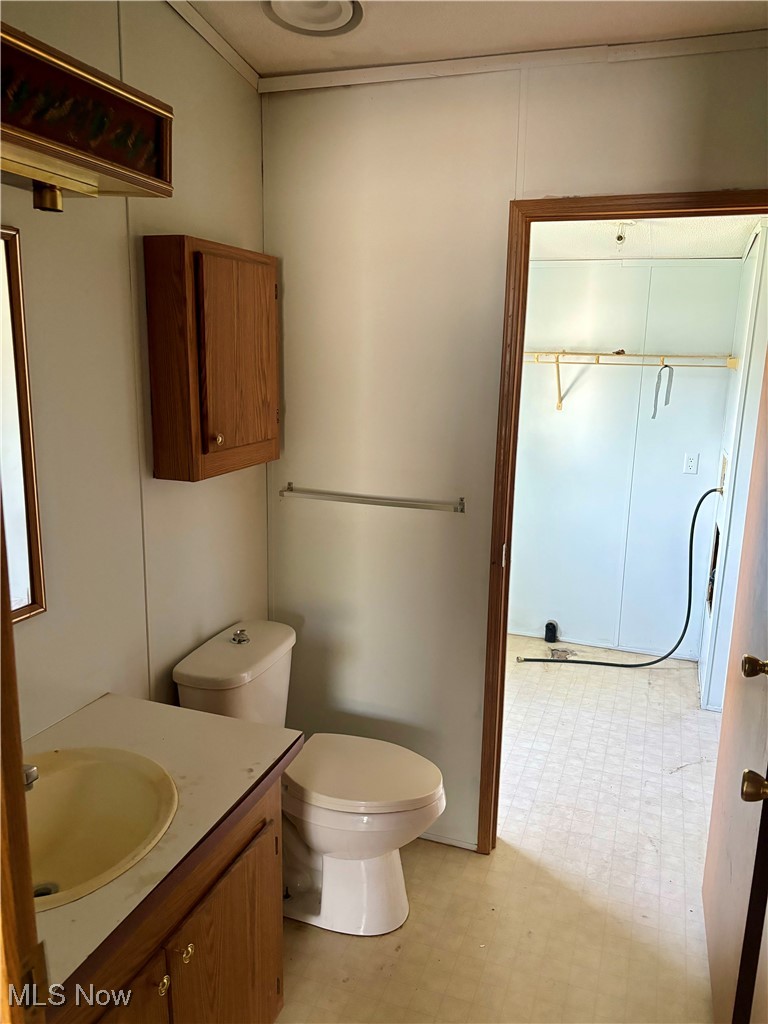 35 Sand Ridge Road Zanesville, OH 43701 - Photo 17 of 28 Bathroom with tile patterned flooring, vanity, and toilet