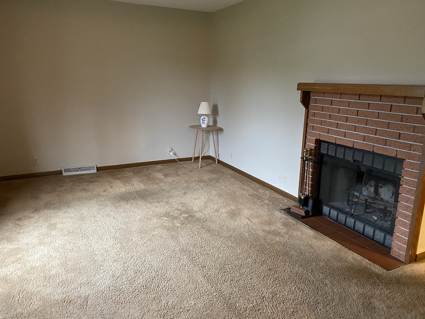 231 East Iowa Street Spring Valley, IL 61362 - Photo 3 of 13 a view of an empty room with a fireplace