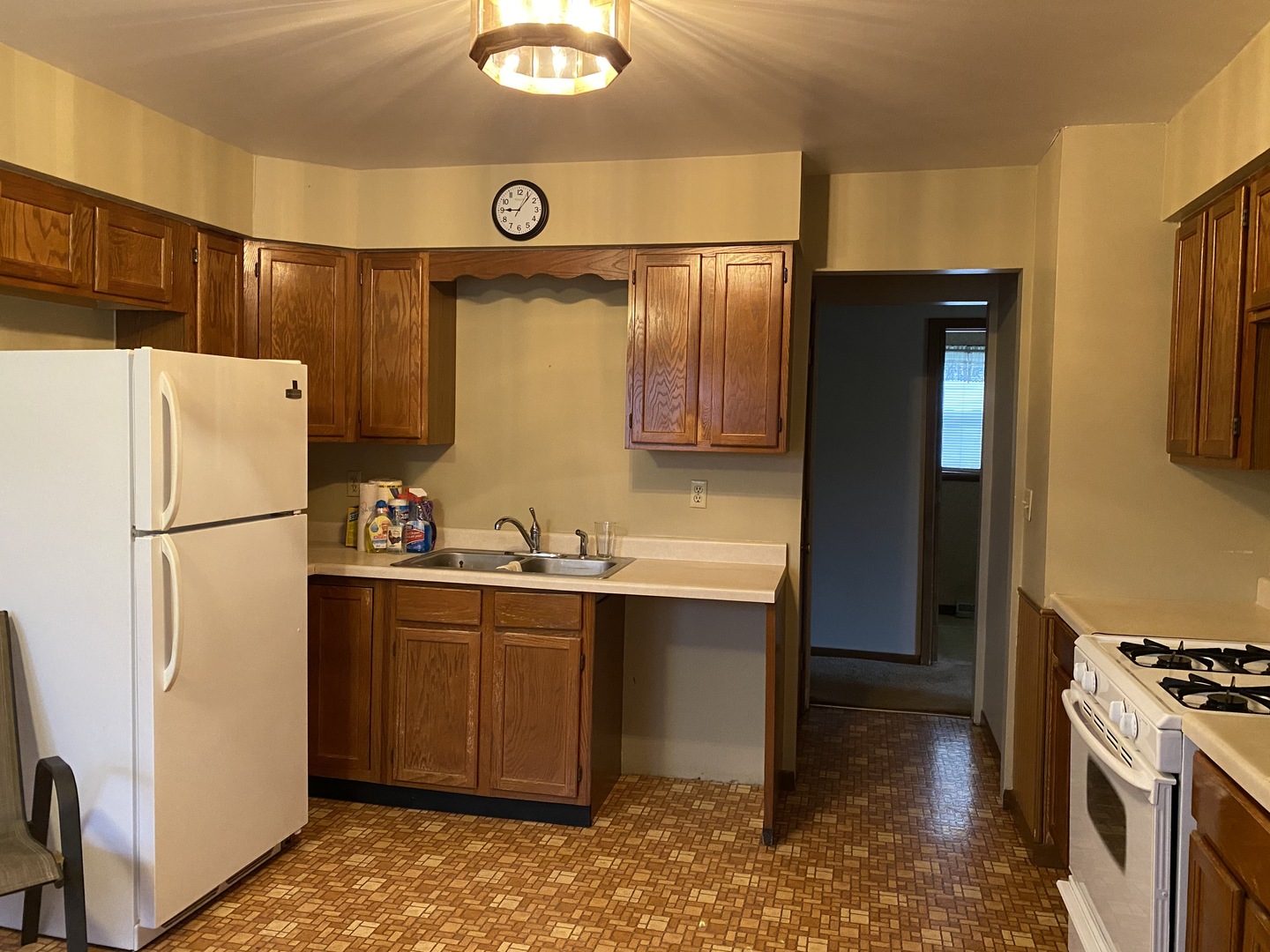 231 East Iowa Street Spring Valley, IL 61362 - Photo 6 of 13 a kitchen with stainless steel appliances a refrigerator and a stove