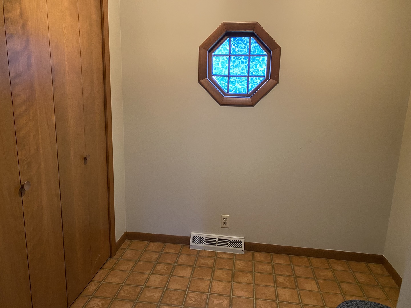 231 East Iowa Street Spring Valley, IL 61362 - Photo 7 of 13 an empty room with wooden floor and windows