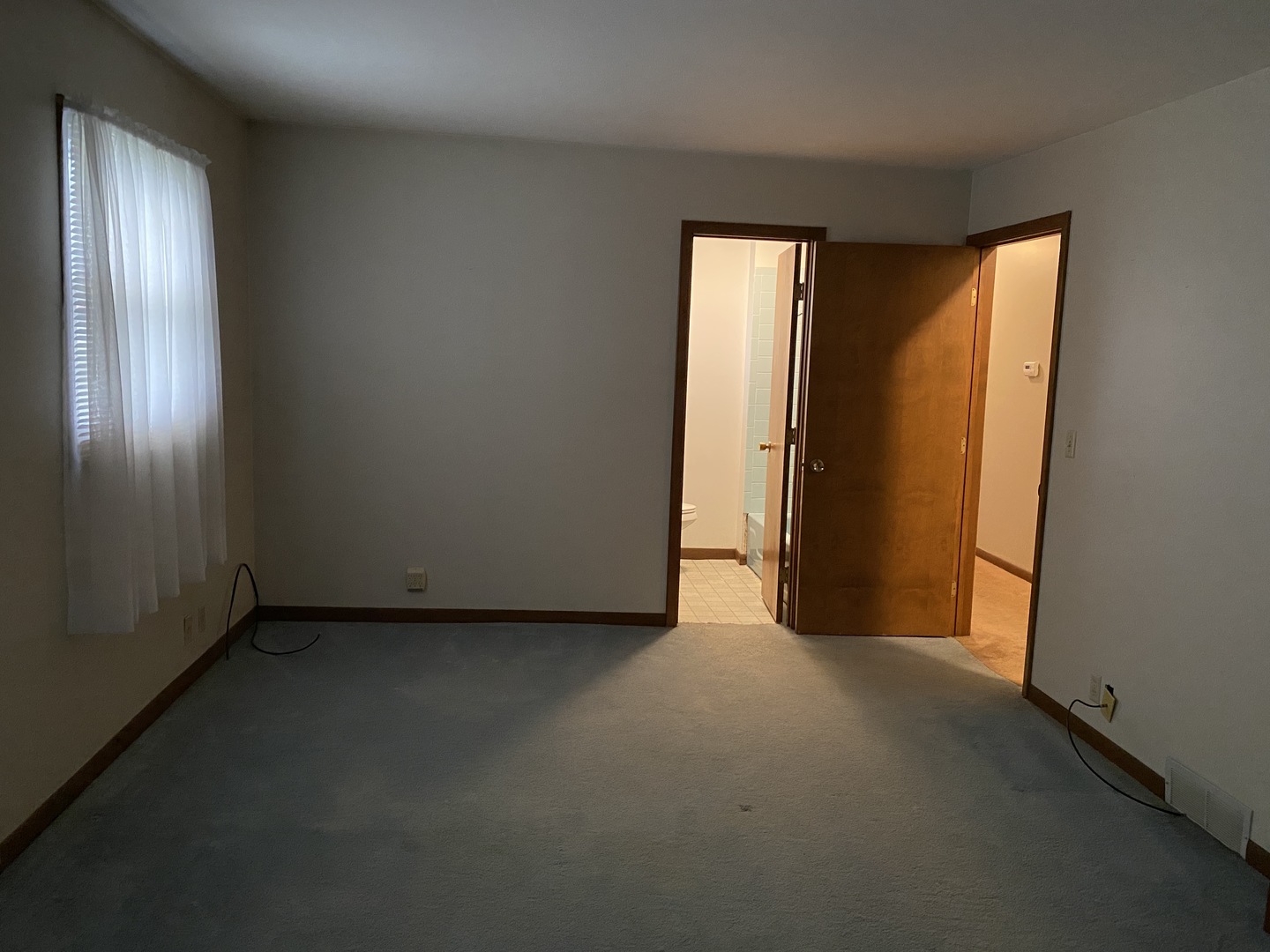 231 East Iowa Street Spring Valley, IL 61362 - Photo 8 of 13 an empty room with windows and closet
