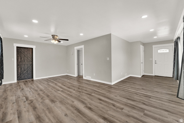 716 East Factory Street Garland, UT 84312 - Photo 9 of 30 Spacious living area featuring wood-finish flooring, recessed lighting, and a ceiling fan