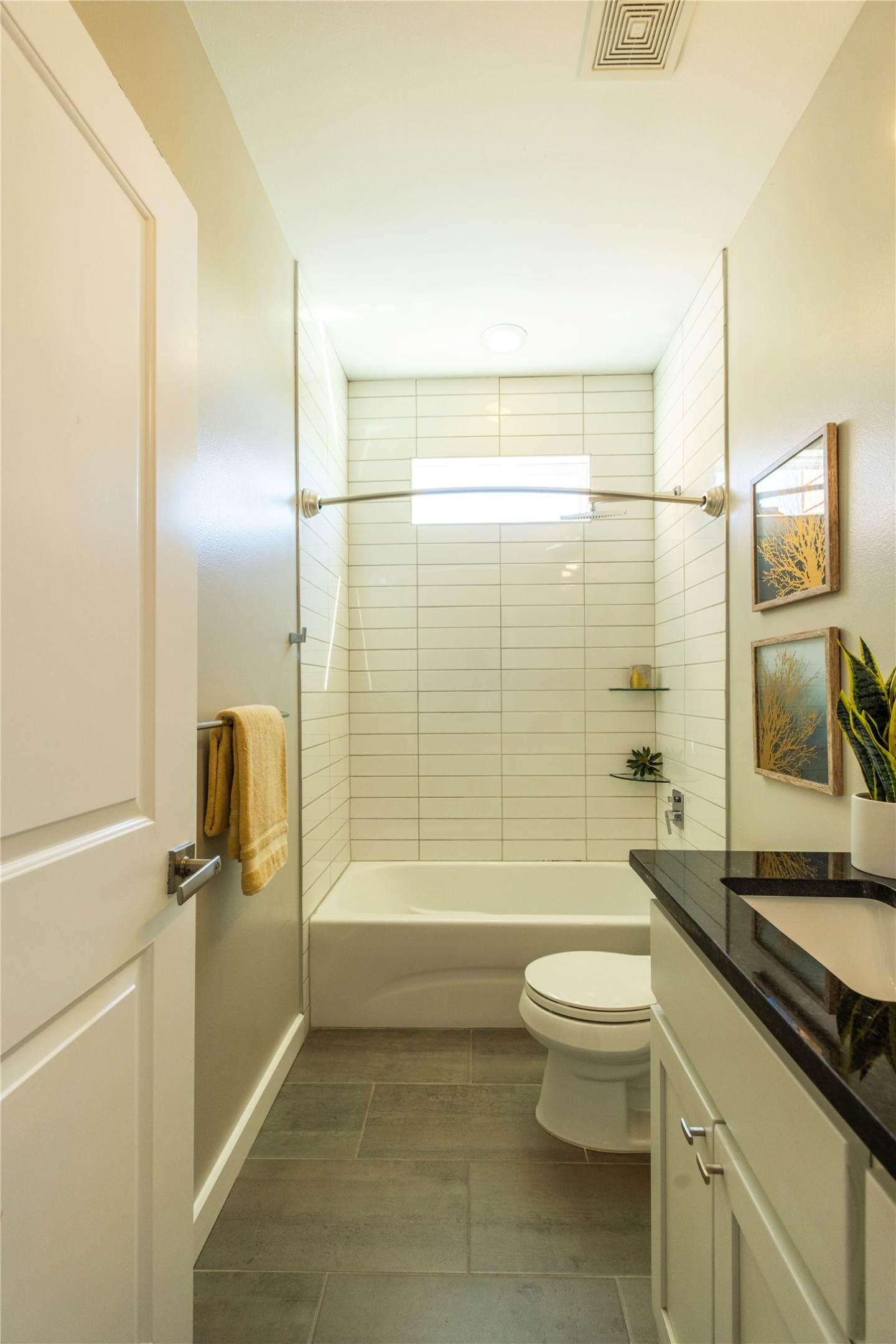 7601 Bethune Avenue, Unit B Austin, TX 78752 - Photo 27 of 39 Full bath featuring shower combination, vanity, and dark tile patterned flooring