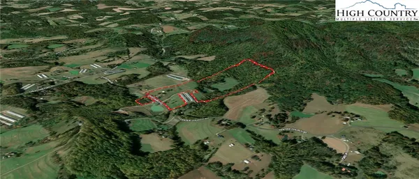an aerial view of a house with a yard and street view