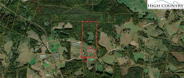 an aerial view of a house with yard