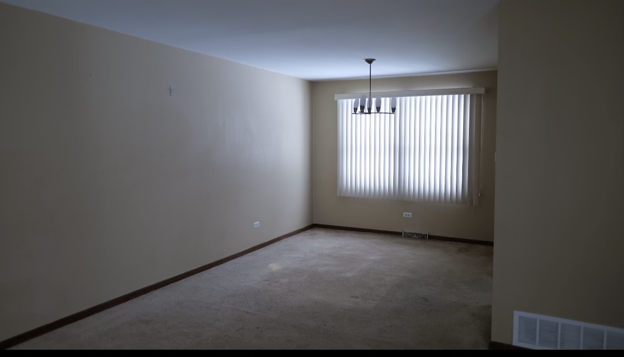 748 Old Meadow Road Matteson, IL 60443 - Photo 3 of 10 an empty room that has a window