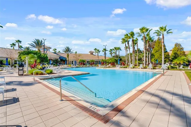 a view of swimming pool with outdoor seating