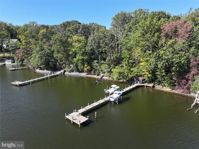 an aerial view of a houses with ocean view