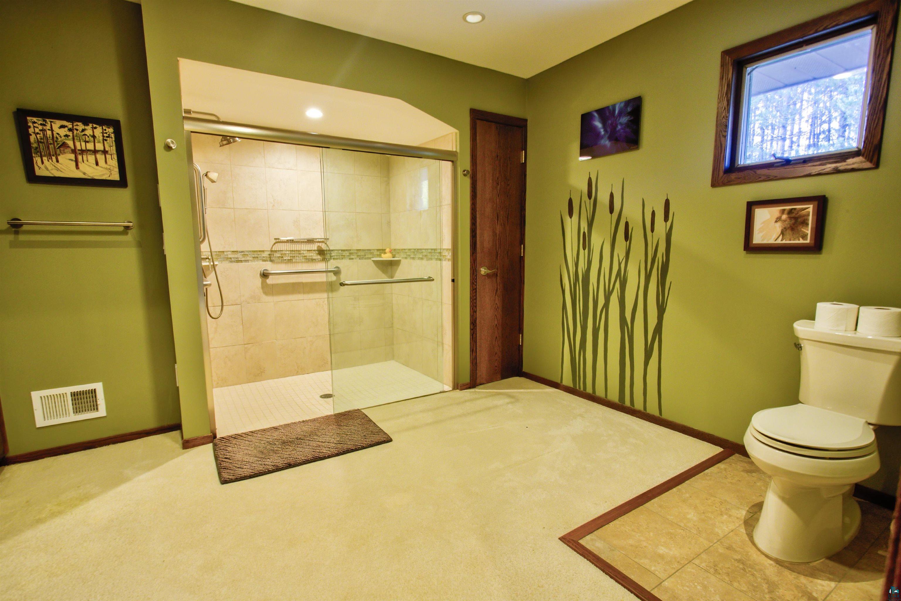 1933 West Shagawa Road Ely, MN 55731 - Photo 36 of 46 Bathroom featuring a shower with door and toilet