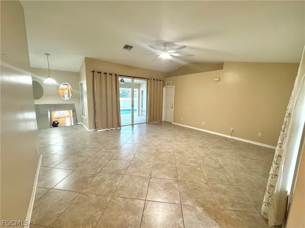 a view of livingroom with hardwood floor and a ceiling fan