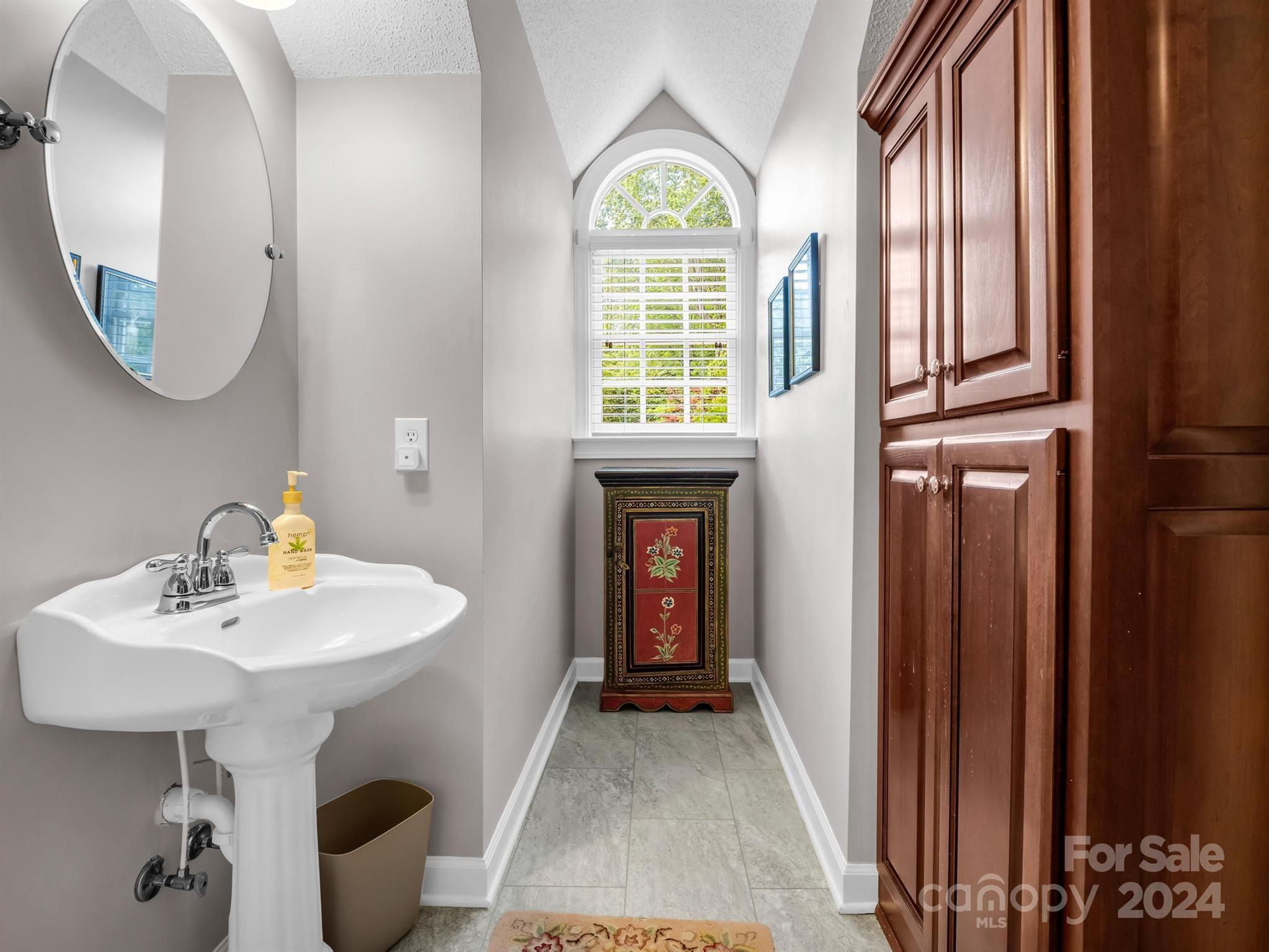 107 Fairforest Drive Rutherfordton, NC 28139 - Photo 24 of 33 a en suite bathroom with a sink and a mirror