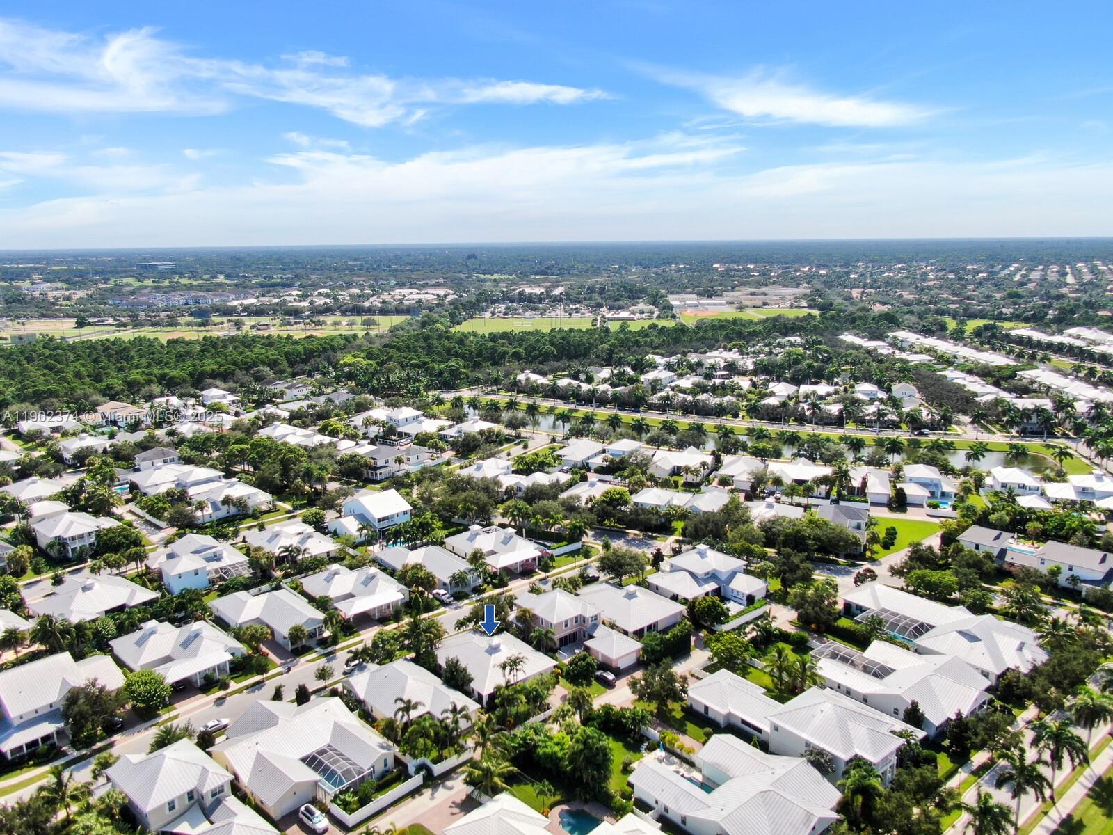 1053 Big Pine Way Jupiter, FL 33458 - Photo 39 of 48 an aerial view of a city with lots of residential buildings