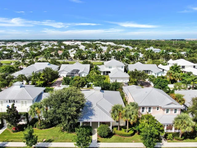 an aerial view of residential building with green space