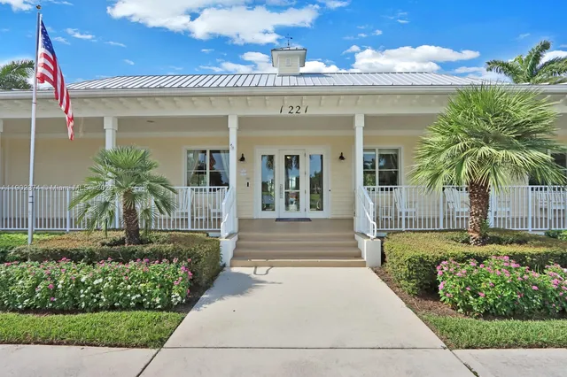 a living room with furniture and a clock