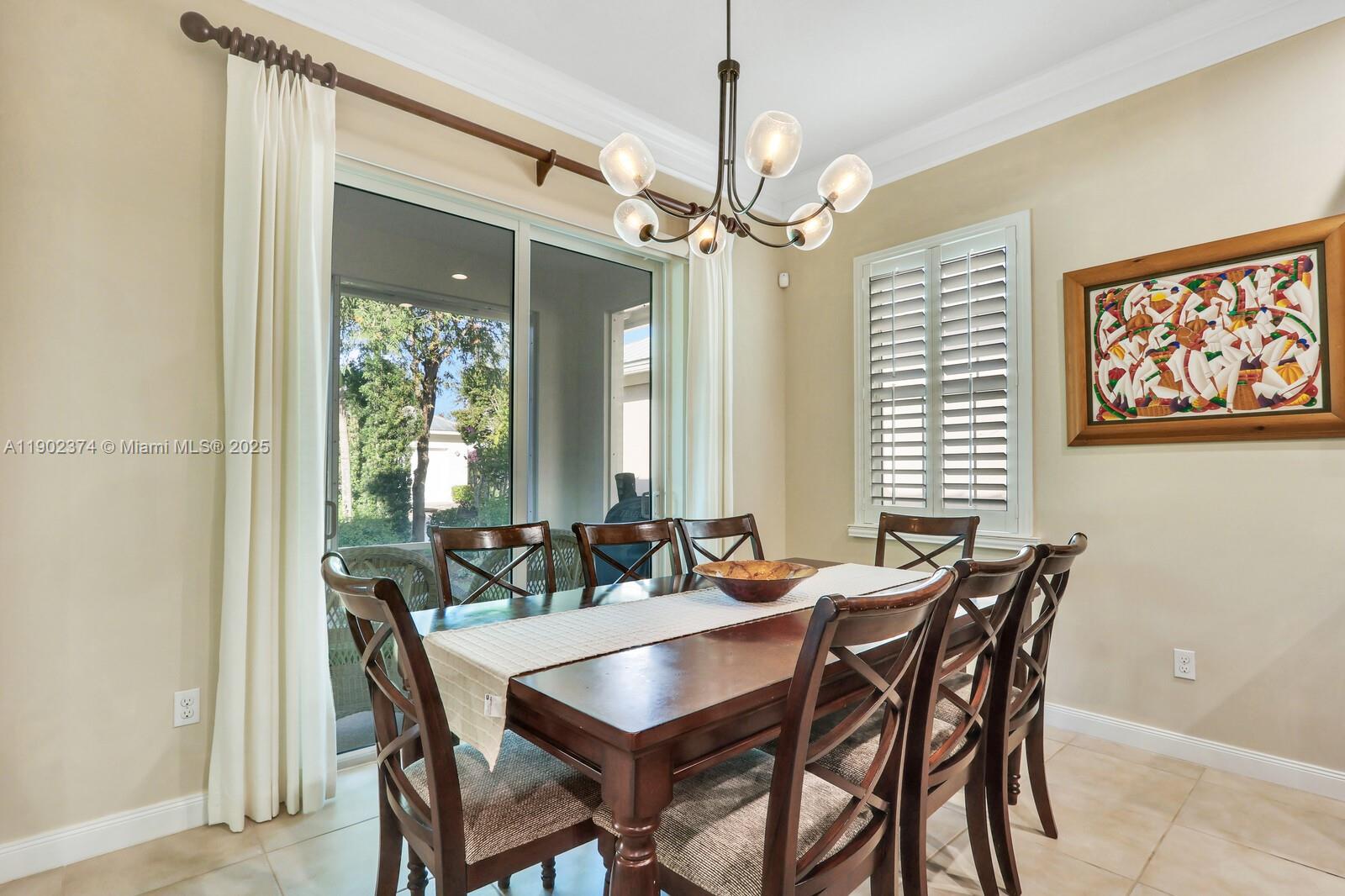 1053 Big Pine Way Jupiter, FL 33458 - Photo 9 of 48 a view of a dining room with furniture window and outside view