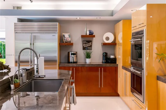 a kitchen with a sink and appliances